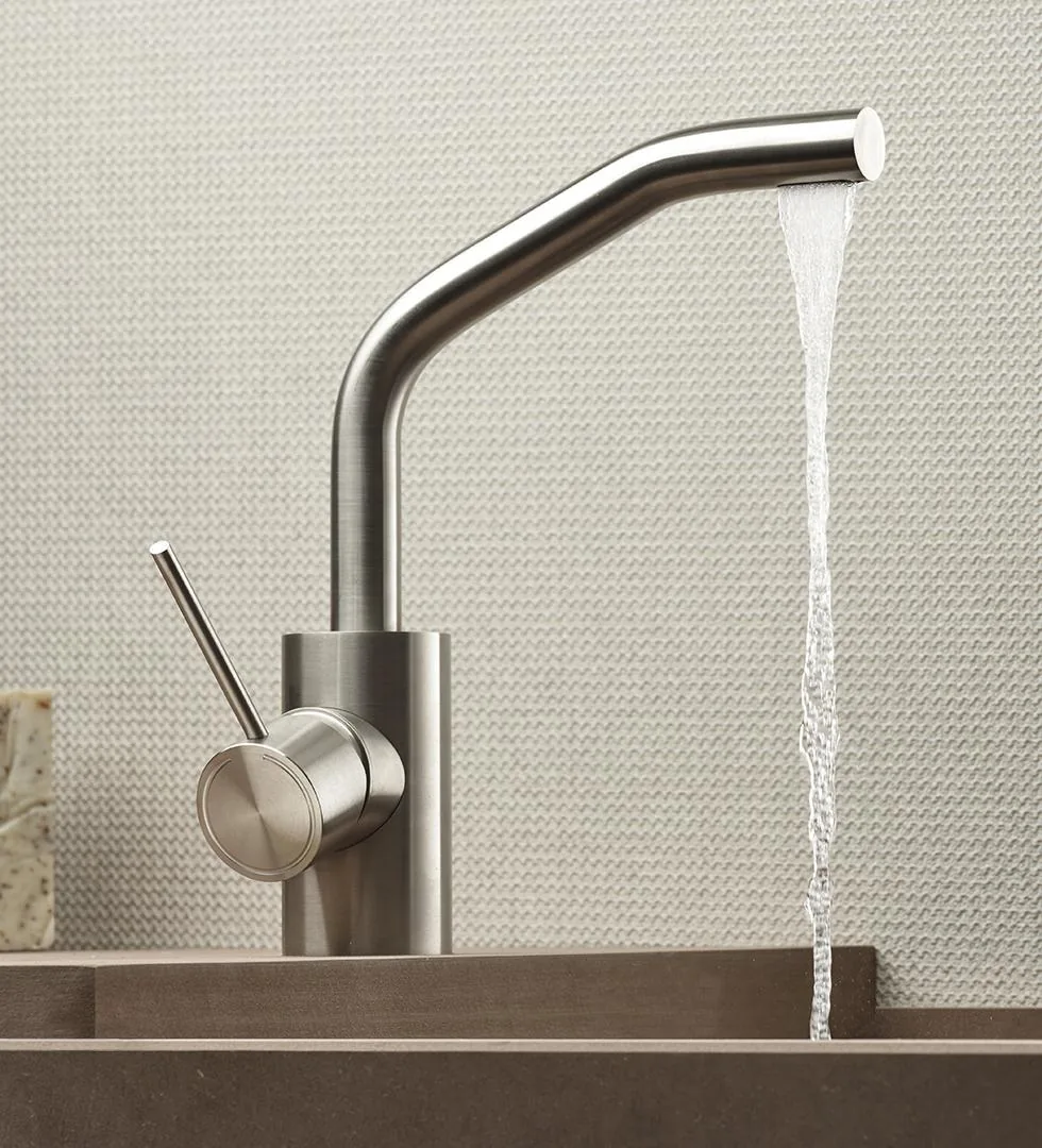 Single-lever deck-mounted 316L basin mixer with a projecting spout in brushed stainless steel
