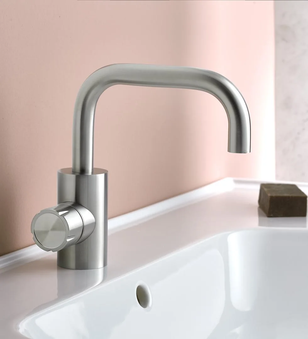 Deck mounted basin mixer in AISI 316L stainless steel with a gold PVD finish