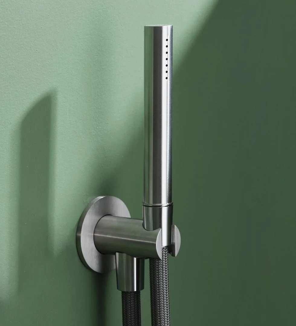 Half inch wall water inlet in AISI 316L stainless steel, cast with an integral hand shower cradle